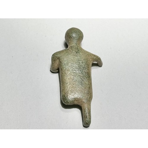 9 - Iron Age Figurine. Circa 200 BCE. Copper-alloy, 38.20g. 58.72 x 31.68 mm. A rare anthropomorphic fig... 