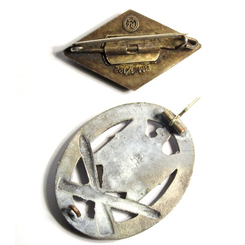 73 - Military Group, WWII German badges (2). Lozenge shaped enamel party badge and a military issue displ... 