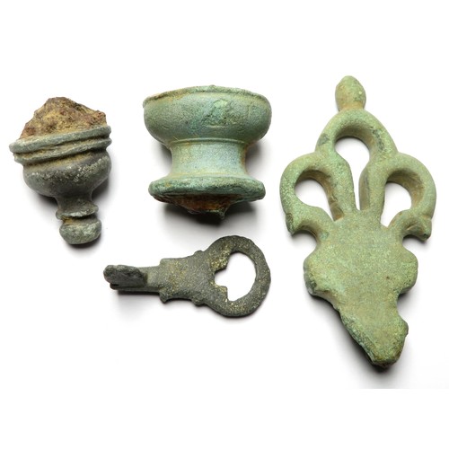 29 - Roman lock and key group. Circa 1st-3rd century CE. A Roman bronze key, trifoliate key handle and tw... 