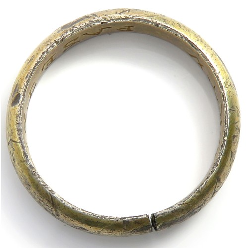 68 - Silver Gilt Posy Ring. Circa 16th century CE. 25mm, 5.5mm wide. 6.29g. The ring is formed of a D-sha... 