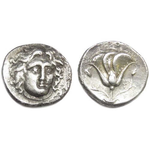 83 - Islands of Caria-Rhodes. 275-250 BC. Didrachm. Silver, 6.35g. 21mm. Head of Helios facing slightly r... 