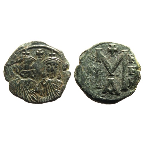 206 - Byzantine Bronze Coin. Copper-alloy, 6.48g. 23mm. Crowned and drapped facing bust. R. Large M, A bel... 