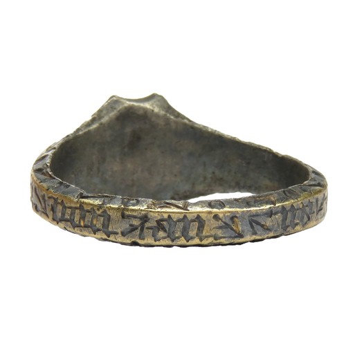 55 - Medieval Gold and Silver Intaglio Ring c. 15th century. A silver ring with an applied band of gold a... 