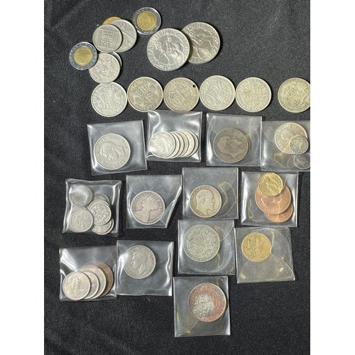 473A - Collectors Lot: To include an accumulation of coins, stamps and medals as well as some literature on... 