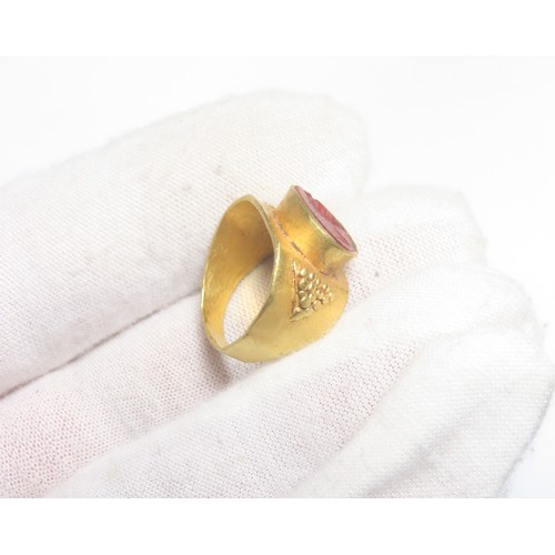 45 - Ancient Roman Gold Intaglio Ring. Circa 2nd century CE. 5.37g. 20mm, 16mm internal. Formed of a wide... 