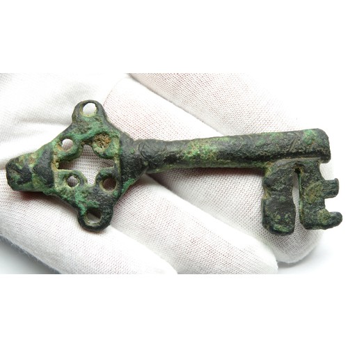 62 - Large Medieval Bronze Key. Circa 14th-15th century CE. An impressive hollow shafted key with an elab... 