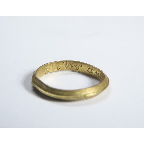 72 - Gold Mourning Ring. Circa 17th century CE. 22mm, 2.53 grams. A plain gold ring with a raised central... 