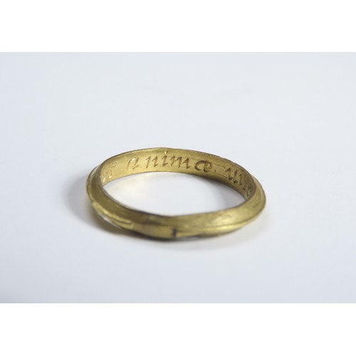 72 - Gold Mourning Ring. Circa 17th century CE. 22mm, 2.53 grams. A plain gold ring with a raised central... 