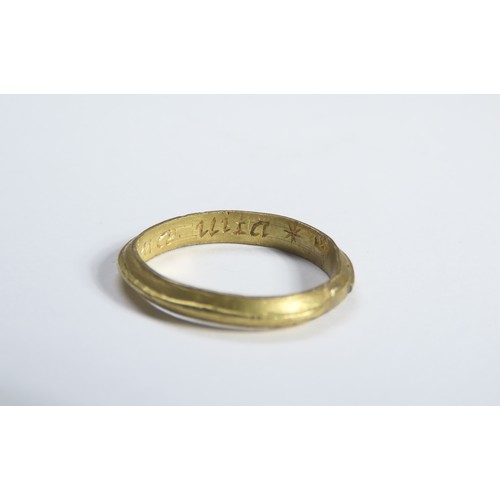 72 - Gold Mourning Ring. Circa 17th century CE. 22mm, 2.53 grams. A plain gold ring with a raised central... 