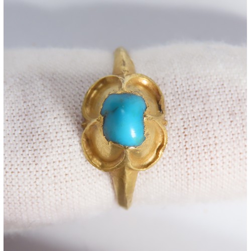 68 - Medieval gold and turquoise ring. Circa 16th century CE. A high carat yellow gold finger ring with a... 