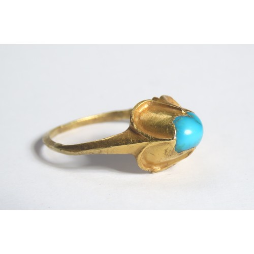 68 - Medieval gold and turquoise ring. Circa 16th century CE. A high carat yellow gold finger ring with a... 