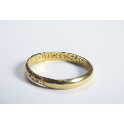 73 - Gold Momento Mori Finger Ring. Circa 1700 CE. A plain band engraved with a stylised skull and inscri... 