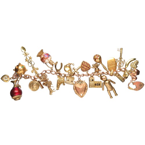 76 - Gold charm bracelet 89.5g total 9ct with 21 charms including a gem-set heart, heart locket, 2 jugs w... 