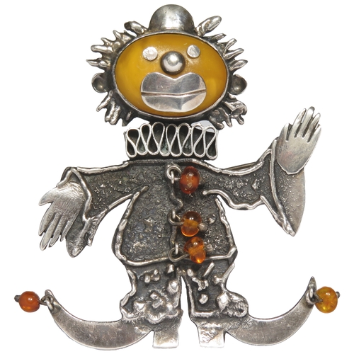 81 - Silver and amber clown brooch. 70mm, 20g.