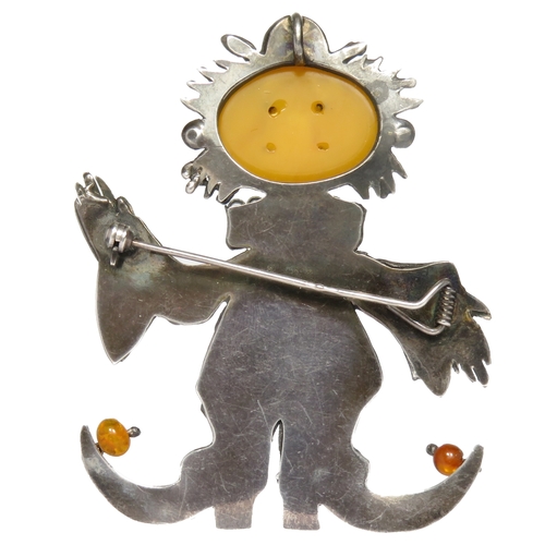 81 - Silver and amber clown brooch. 70mm, 20g.