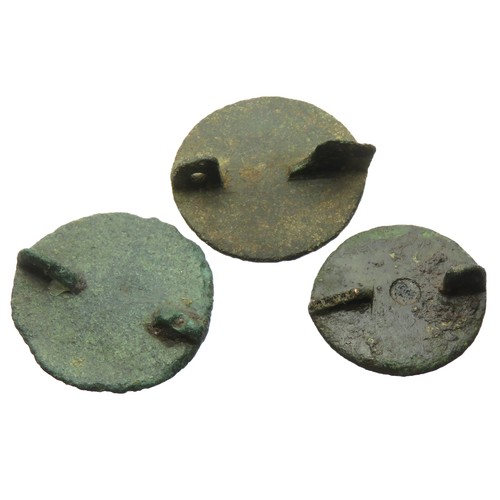 31 - Three Roman disc brooches with champleve enamel decoration, 2nd century AD largest 22mm.