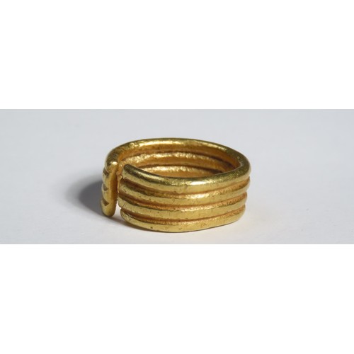 102 - Bronze Age gold ring ornament. Middle Bronze Age penannular ring, circa 1300-1150 BCE. Comprised of ... 