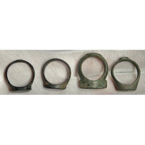 114 - Collection of ancient finger rings (4). Circa 5th-12th century CE. Copper-alloy, 24mm-30mm overall w... 