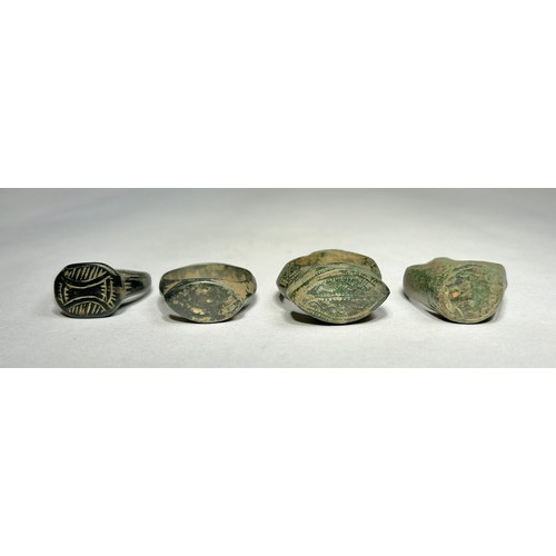 114 - Collection of ancient finger rings (4). Circa 5th-12th century CE. Copper-alloy, 24mm-30mm overall w... 