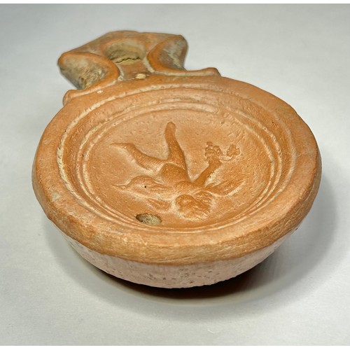 117 - Roman Terracotta oil lamp. Loeschcke type I C, circa 1st century AD. A Mold made type, filling-hole ... 