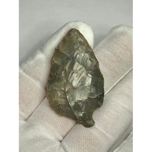 96 - Neolithic leaf-shaped flint arrow-head. Circa 3500 BCE. 50mm x 29mm. Knapped from a piece of dark br... 