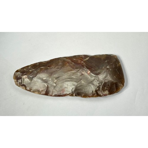 97 - Middle Neolithic flint axe. Circa 5000 BCE. Knapped from a brown and mauve mottled flint, and has a ... 