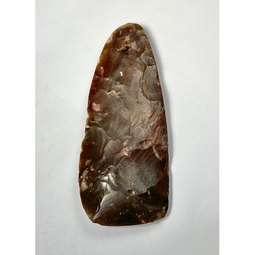 97 - Middle Neolithic flint axe. Circa 5000 BCE. Knapped from a brown and mauve mottled flint, and has a ... 