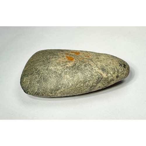 98 - A Cornish Neolithic polished green stone axe. Circa 5000 BCE. 91mm x 48mm. Complete and undamaged wi... 