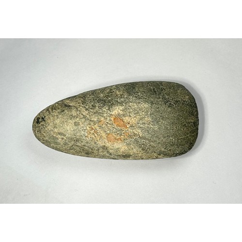 98 - A Cornish Neolithic polished green stone axe. Circa 5000 BCE. 91mm x 48mm. Complete and undamaged wi... 