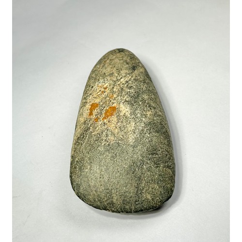 98 - A Cornish Neolithic polished green stone axe. Circa 5000 BCE. 91mm x 48mm. Complete and undamaged wi... 