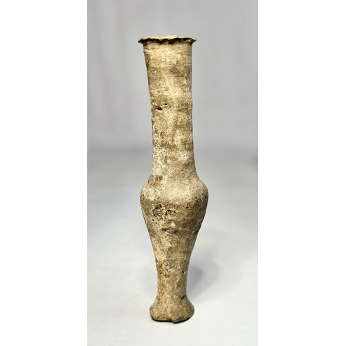 120 - Roman pottery Unguentarium. Circa 1st-2nd century CE. 122mm. A dark grey clay bottle with an elongat... 