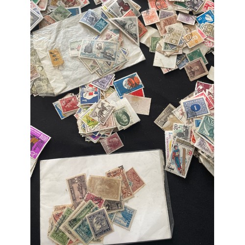 187 - Large Collection of loose world stamps. To include, British empire, commonwealth and independant sta... 