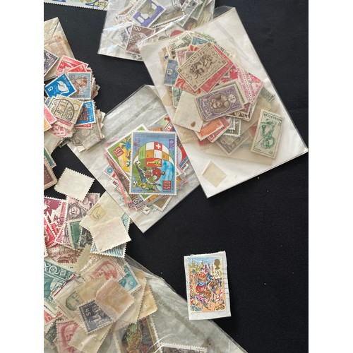 187 - Large Collection of loose world stamps. To include, British empire, commonwealth and independant sta... 