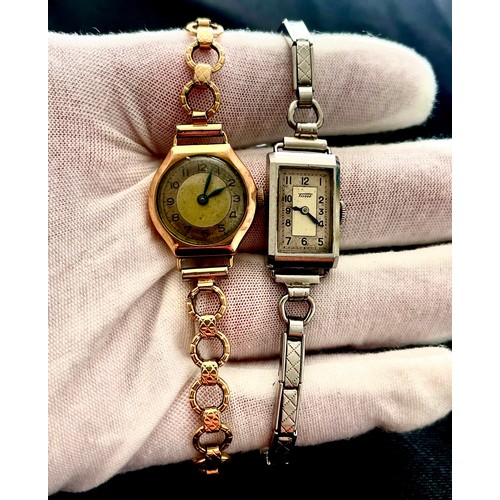 137 - Two ladies cocktail watches, post war period. A 9ct gold watch with rolled gold bracelet and a stanl... 