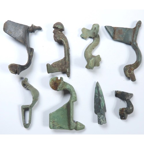 36 - Collection of Roman brooches. Circa 2nd-4th century CE. Copper-alloy, 3g-7.3g. 29mm-44mm. Various ty... 