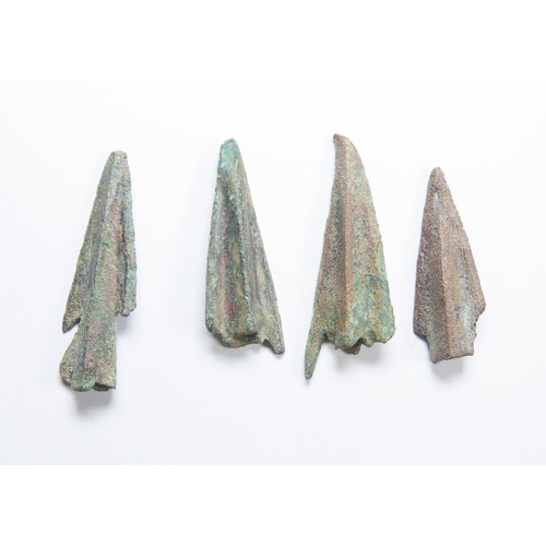 28 - Anatolian cast bronze trilobate arrowheads (5). Circa 10th-6th Century BCE. Socketed with three shar... 