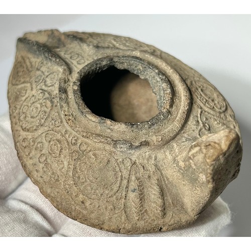 56 - Byzantine oil lamp. circa 5th-8th century CE. Decorated with foliate scrolls and circular panels of ... 