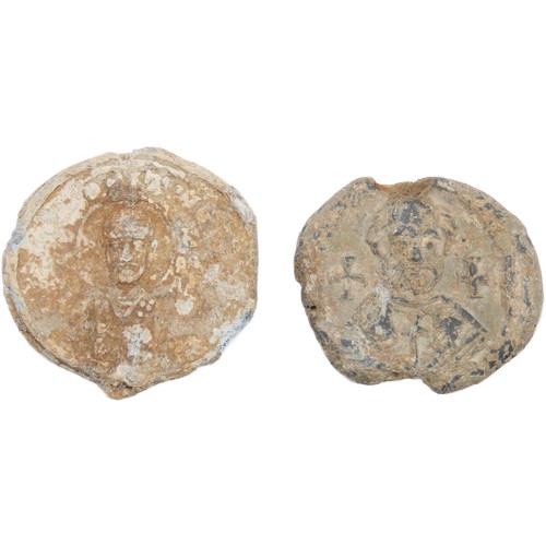 60 - Byzantine lead Bullae (document seals)(2). Circa 8th-10th century CE. Both displaying figures of a s... 