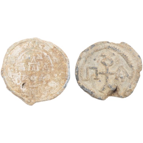 60 - Byzantine lead Bullae (document seals)(2). Circa 8th-10th century CE. Both displaying figures of a s... 