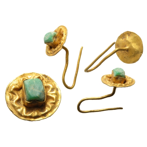 51 - Roman gold earing. Circa 3rd-4th century CE. Formed of a floral embossed disc with a rectangular set... 