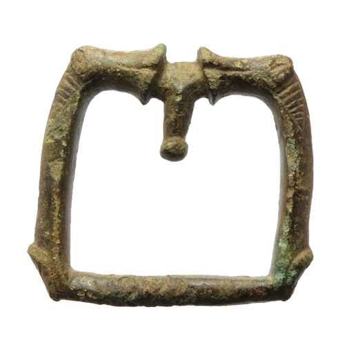 64 - Anglo-Saxon zoomorphic buckle. An elaborate cast copper alloy buckle. The frame is square and has a ... 