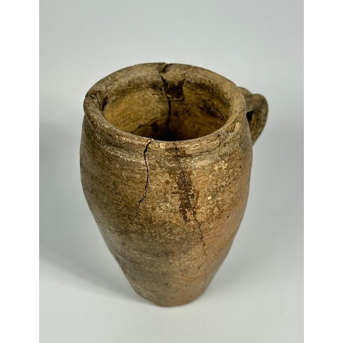 82 - 14th Century medieval pottery cup. 98mm x 55mm. A barrel-shaped vessel with a flat base and small ha... 