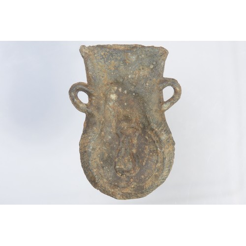 85 - Medieval pilgrims ampulla. Circa 15th century CE. Lead-alloy, 33.52g. 53mm. Pouch-shaped with suspen... 