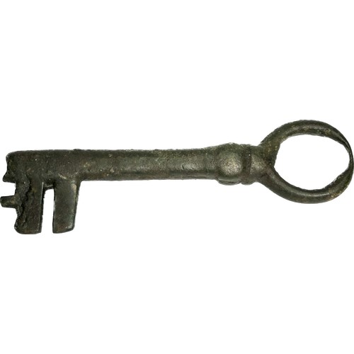 98 - Large medieval bronze key. Circa 14th century CE. Copper-alloy, 46.18g. 102mm. The key has a long ho... 