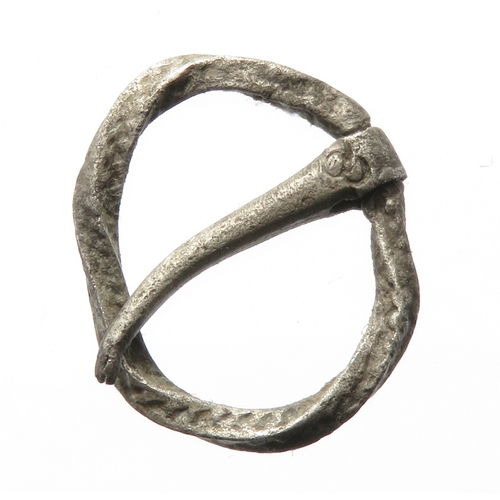 105 - Medieval silver annular brooch having a twisted frame with wrigglework decoration and a hinged pin f... 