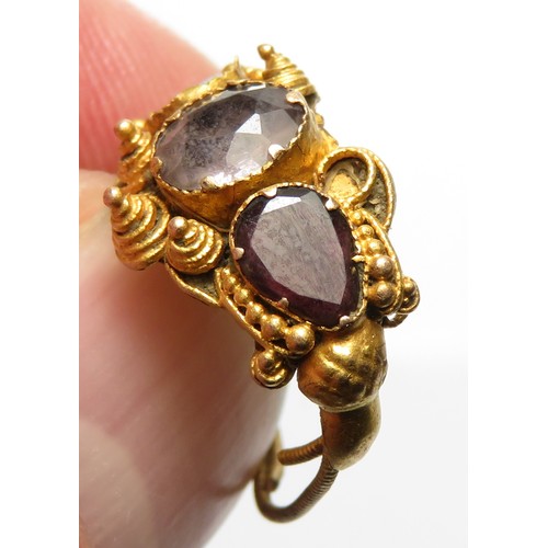 113 - Gold ring with amethysts. Approximately 20mm x 10mm, 1.72g.