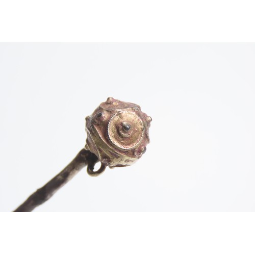 109 - Tudor silver gilt ball-headed dress pin. Circa 1500-1600 CE. 4.58g, 74mm. Each hemisphere is decorat... 