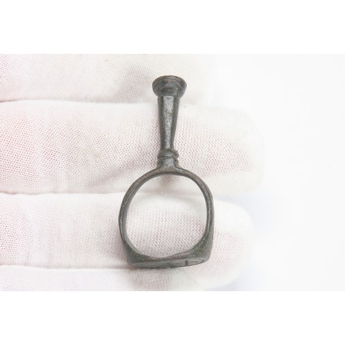 126 - Post-medieval combination pipe tamper ring. Circa 1650 CE. A finger ring with an intergrated pipe ta... 