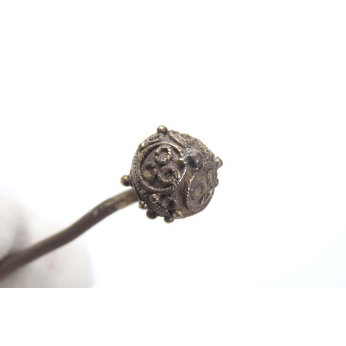 118 - Tudor silver gilt ball-headed dress pin. Circa 1500-1600 CE. 4.49g, 84mm. Each hemisphere is decorat... 