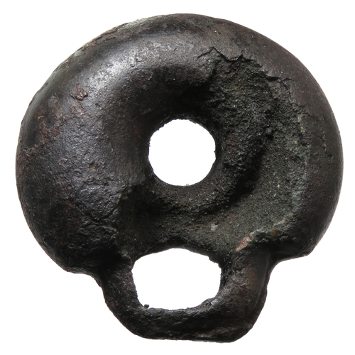 13 - Late Bronze age harness fitting c. 1150BC - 1000BC. A sub-circular copper alloy harness fitting with... 